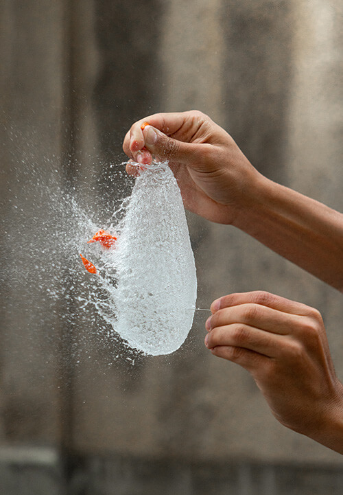 Water balloon in full explosion, symbolizing the end of barriers and that there are no limits.